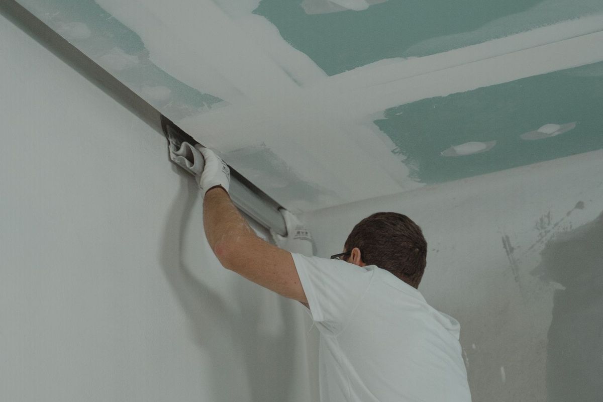 Drywall being finished on a ceiling